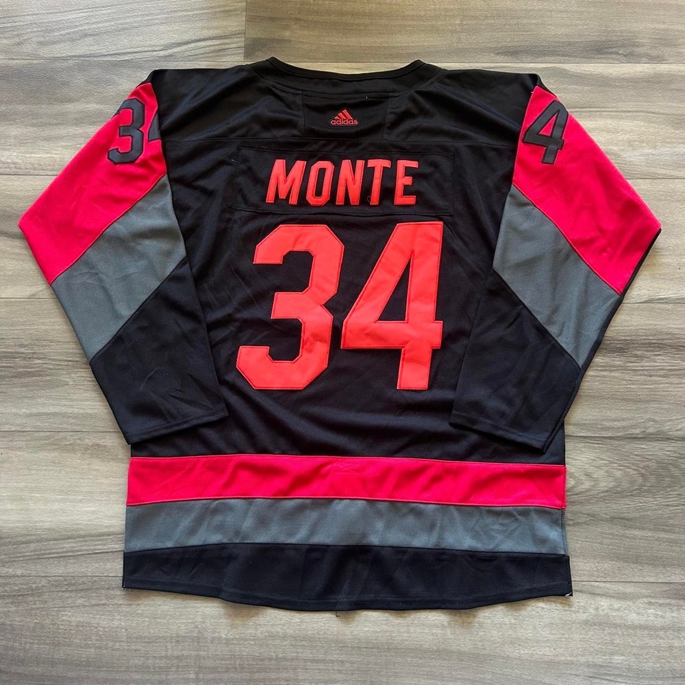 Adidas Carolina Hurricanes #34 Jordan Monte black jersey with red and gray panel